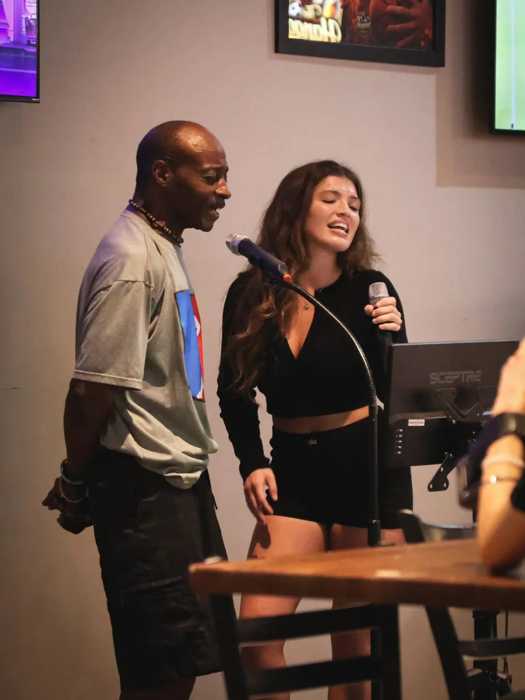 Two singers enjoying a duet at The Hangout